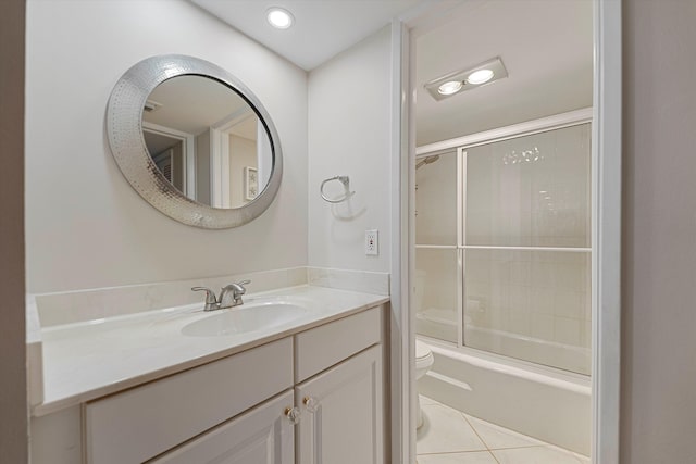 full bath featuring tile patterned flooring, toilet, recessed lighting, shower / bath combination with glass door, and vanity