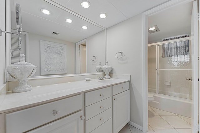 bathroom with recessed lighting, visible vents, toilet, vanity, and tile patterned floors