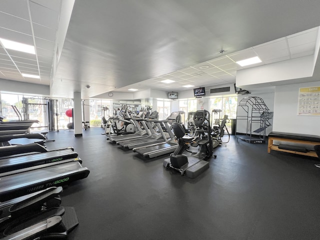 exercise room with a drop ceiling