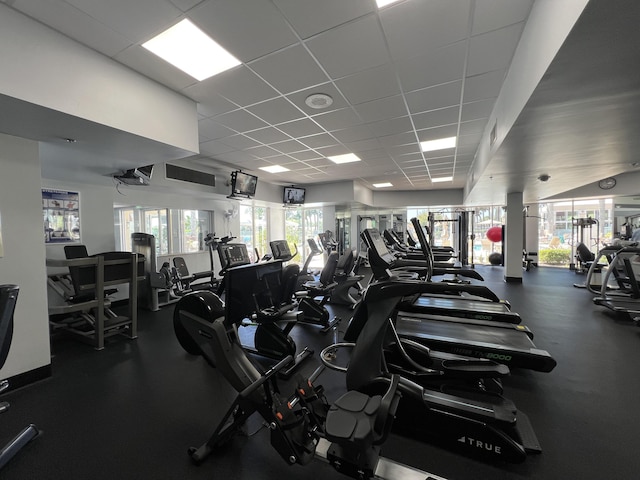 gym featuring a paneled ceiling and visible vents