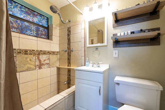 full bath with toilet, vanity, and tiled shower / bath combo