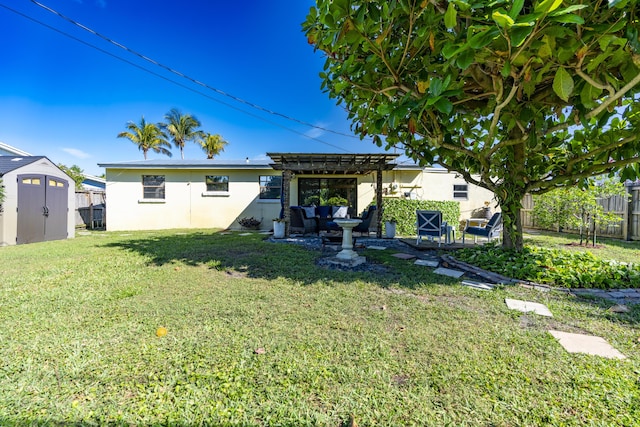 back of property featuring stucco siding, a lawn, a pergola, a fenced backyard, and an outdoor structure