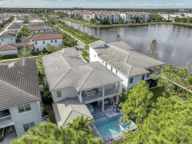 aerial view with a water view and a residential view