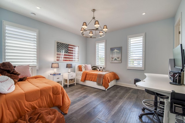 bedroom featuring dark wood-style floors, baseboards, and an inviting chandelier