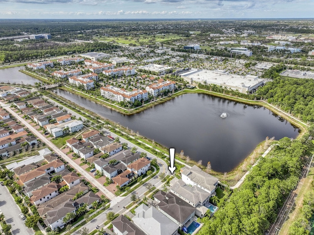 drone / aerial view featuring a water view and a residential view