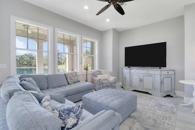 living room with light wood-style flooring, recessed lighting, baseboards, and ceiling fan