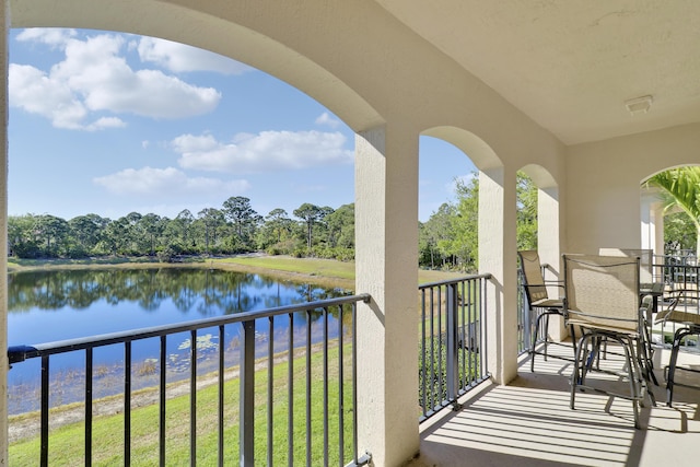 balcony featuring a water view