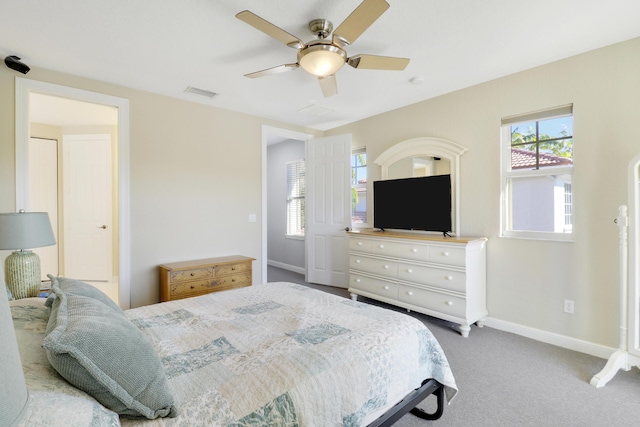 bedroom featuring a ceiling fan, carpet flooring, baseboards, and visible vents