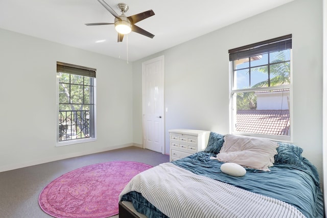 bedroom featuring ceiling fan and baseboards