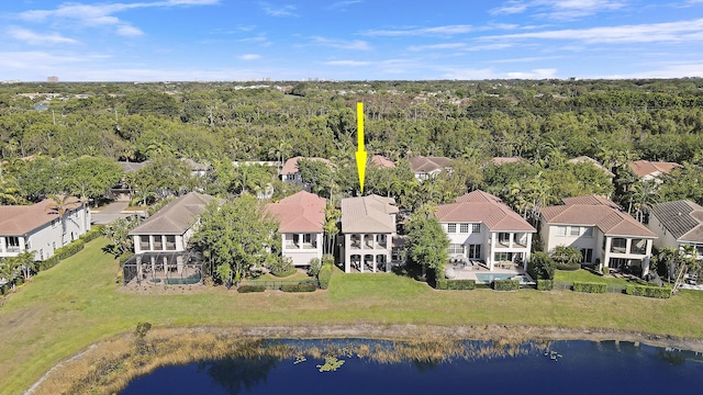 birds eye view of property featuring a residential view, a view of trees, and a water view