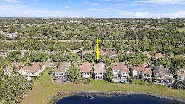 birds eye view of property with a residential view and a water view