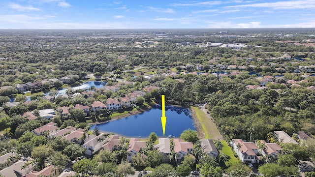 drone / aerial view with a residential view and a water view