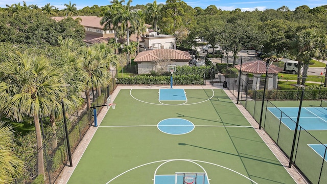 view of sport court featuring community basketball court and fence