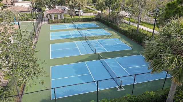 view of sport court with a gazebo and fence