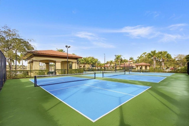 view of tennis court with fence