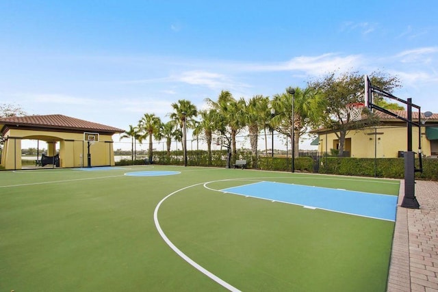 view of basketball court featuring community basketball court and fence