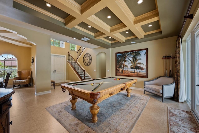 recreation room featuring arched walkways, visible vents, coffered ceiling, beamed ceiling, and baseboards