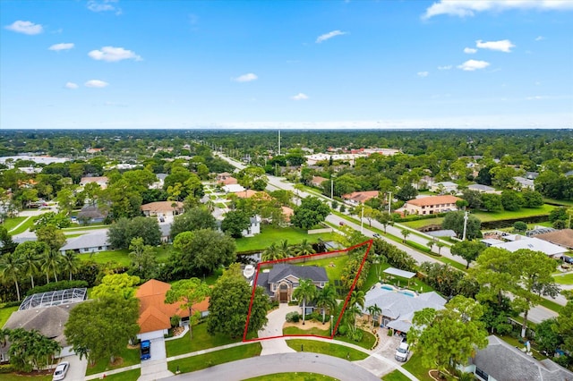 birds eye view of property with a residential view