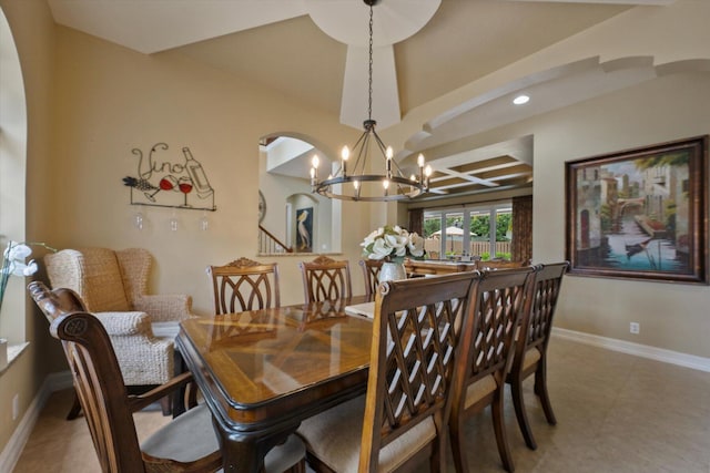 dining room with baseboards, arched walkways, a notable chandelier, and recessed lighting