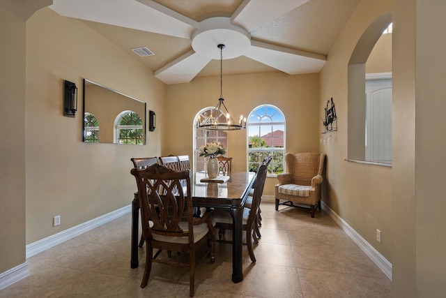 dining room with baseboards, visible vents, arched walkways, and a notable chandelier