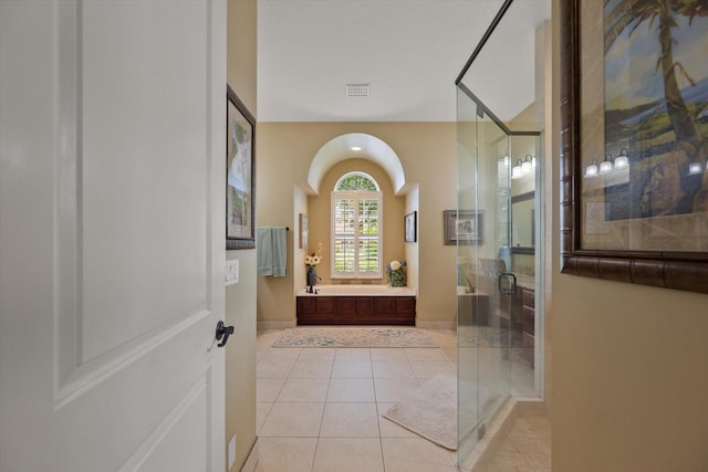 bathroom featuring baseboards, visible vents, tile patterned flooring, vanity, and a shower stall