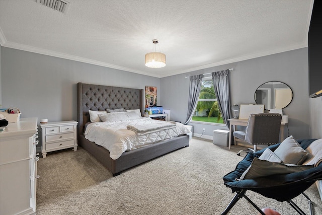 carpeted bedroom featuring a textured ceiling, baseboards, visible vents, and crown molding