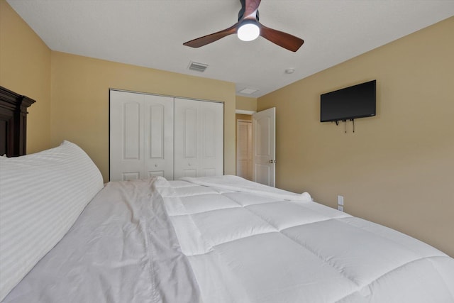 bedroom with a ceiling fan, a closet, and visible vents