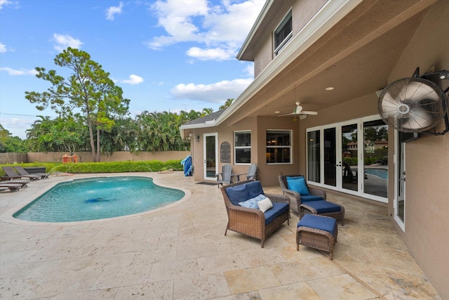 view of pool with a patio area, ceiling fan, fence, and a fenced in pool