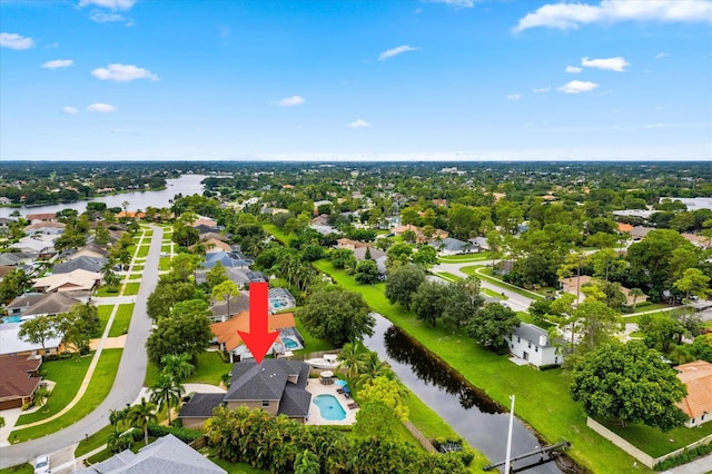 drone / aerial view featuring a residential view and a water view