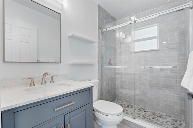 full bathroom featuring toilet, tile walls, and vanity