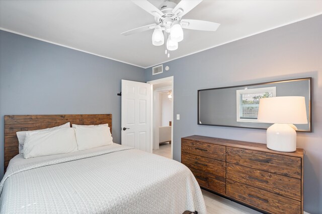 living room with a ceiling fan and light wood-style floors