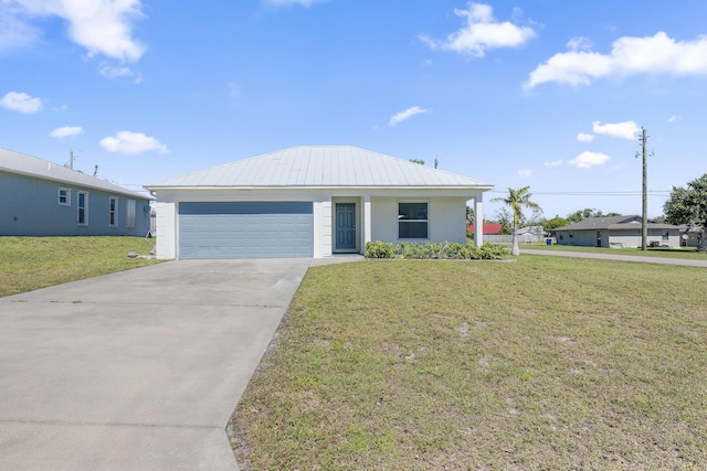 ranch-style home featuring concrete driveway, metal roof, an attached garage, a front lawn, and stucco siding