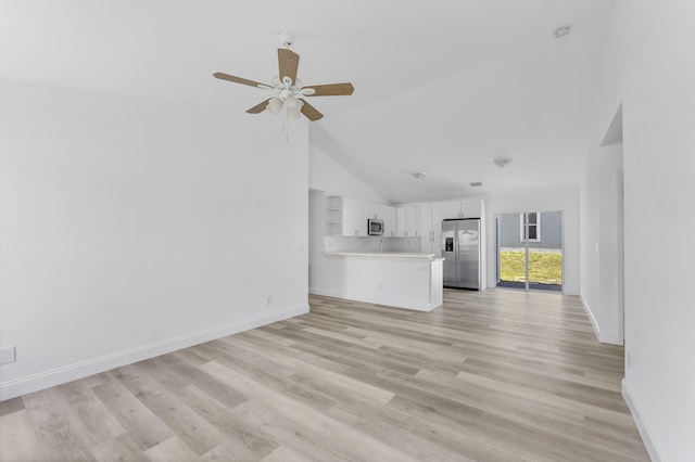 unfurnished living room featuring a ceiling fan, light wood-type flooring, high vaulted ceiling, and baseboards