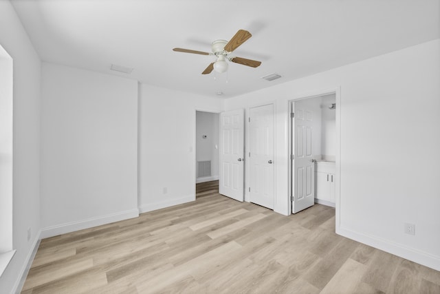 unfurnished bedroom featuring light wood-type flooring, visible vents, and baseboards