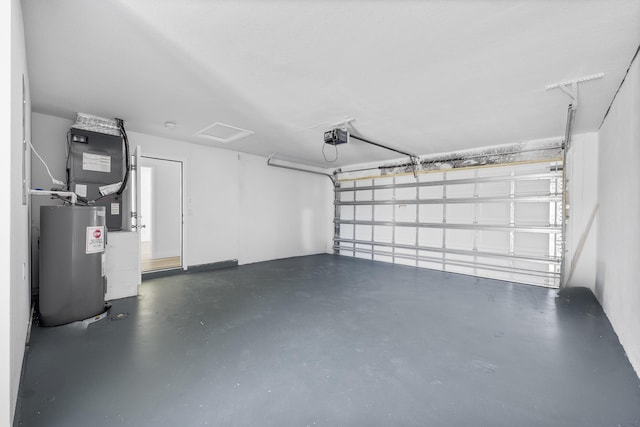 garage featuring water heater and a garage door opener