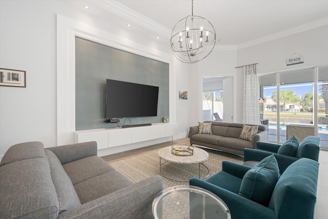 living room with recessed lighting, wood finished floors, an inviting chandelier, and ornamental molding