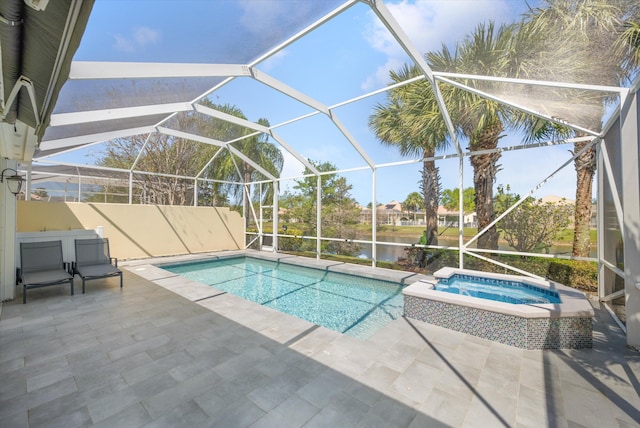 view of swimming pool with glass enclosure, a patio area, a water view, and a pool with connected hot tub