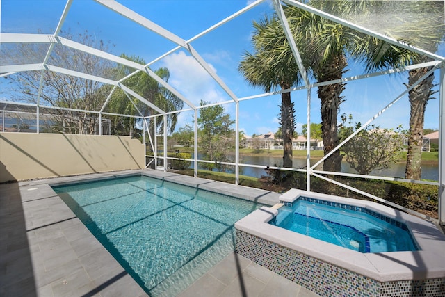 view of swimming pool with a lanai, a water view, a pool with connected hot tub, and a patio