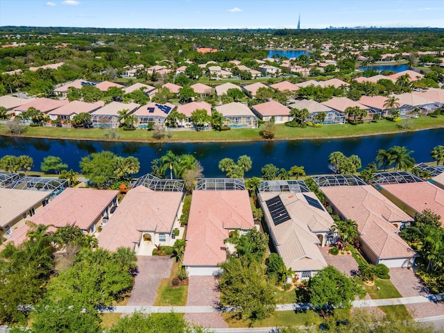 drone / aerial view with a residential view and a water view