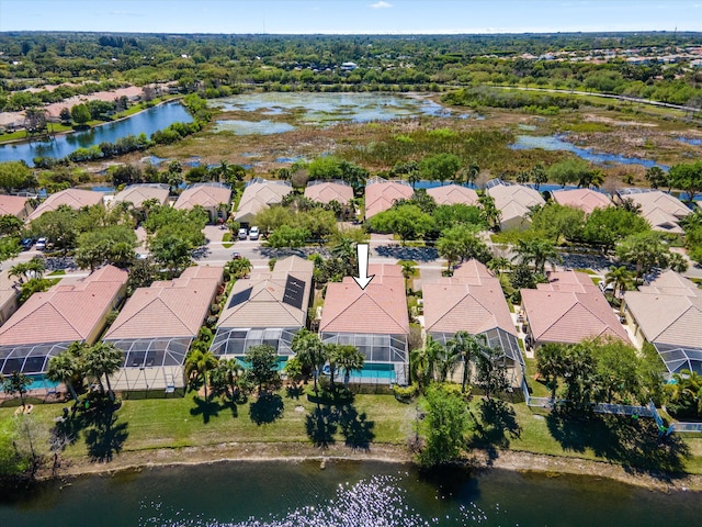 bird's eye view with a residential view and a water view