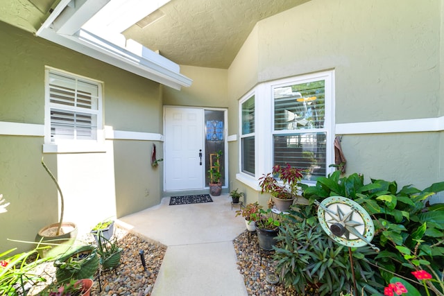 property entrance featuring stucco siding