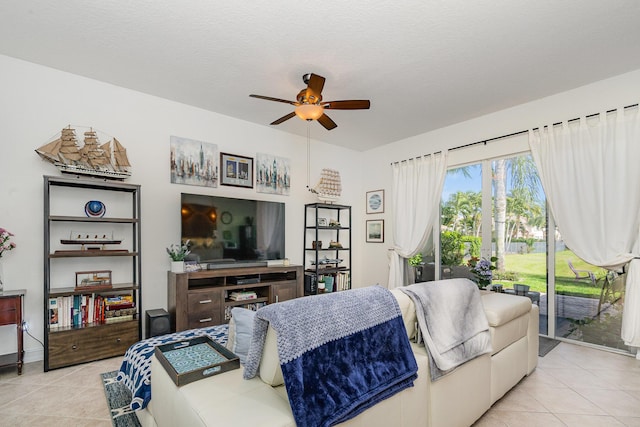 tiled bedroom featuring access to outside, ceiling fan, and a textured ceiling