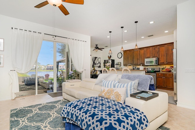 living area with recessed lighting, light tile patterned flooring, ceiling fan, and visible vents