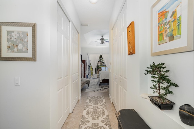 corridor with light tile patterned floors and visible vents