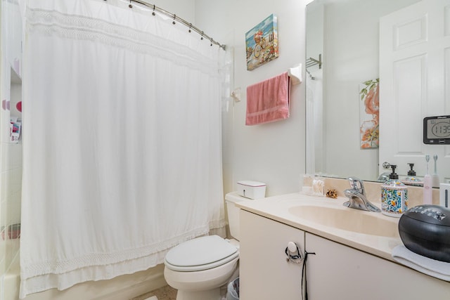 bathroom featuring shower / tub combo with curtain, vanity, and toilet