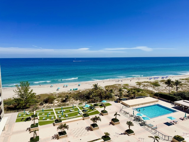 exterior space with a beach view and a water view