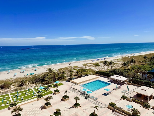 bird's eye view featuring a water view and a view of the beach