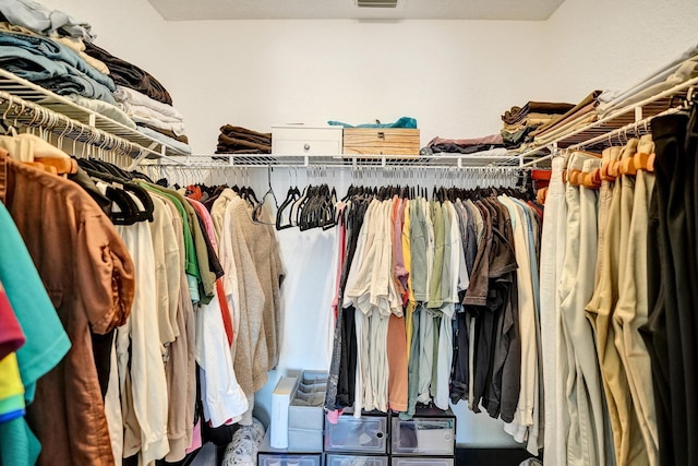 spacious closet featuring visible vents