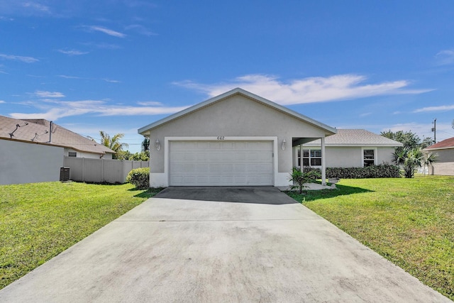 ranch-style house featuring stucco siding, fence, concrete driveway, a front yard, and a garage