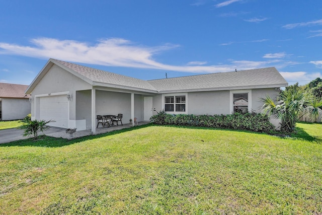 ranch-style house with a shingled roof, a front yard, an attached garage, and stucco siding